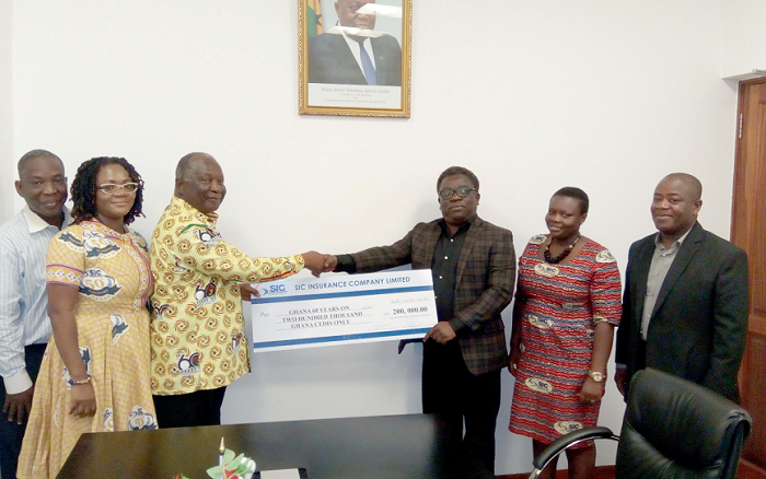 Mr Faris Attrickie (3rd right) presenting the cheque to Mr Amankwah Mr Faris Attrickie (3rd right) presenting the cheque to Mr Amankwah